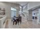 Dining room with chandelier, stairway, and a view to the kitchen with an open floor plan at 53 Precipice Ct, Henderson, NV 89002