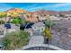 Charming two-story home featuring a spacious driveway and gorgeous mountain views in the background at 53 Precipice Ct, Henderson, NV 89002
