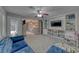 Cozy living room with built-in shelving and a plush blue sofa at 53 Precipice Ct, Henderson, NV 89002