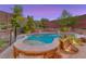 Beautifully landscaped pool area featuring lush greenery, stone accents, and a tranquil setting at 53 Precipice Ct, Henderson, NV 89002