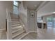 Inviting staircase featuring natural light and light wood-look steps at 53 Precipice Ct, Henderson, NV 89002