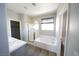 Bright bathroom with tub and shower combo, and double sinks at 5713 Heineken Dr, North Las Vegas, NV 89031