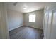 Clean, naturally lit bedroom with modern wood-look flooring and neutral paint at 5713 Heineken Dr, North Las Vegas, NV 89031