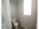 The toilet room features a window for natural light at 5713 Heineken Dr, North Las Vegas, NV 89031