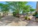 Expansive backyard with mature trees and space for outdoor activities at 5913 Audria Falls Ave, Las Vegas, NV 89131