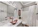 Charming bathroom featuring a marble countertop, unique copper sink, and stylish fixtures at 5913 Audria Falls Ave, Las Vegas, NV 89131