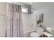 Clean bathroom with a tub, shower, toilet, vanity, and grey shower curtain at 5913 Audria Falls Ave, Las Vegas, NV 89131