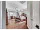 Large bedroom with hardwood floors, a ceiling fan, and a bay window for natural light at 5913 Audria Falls Ave, Las Vegas, NV 89131