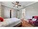 Comfortable bedroom with hardwood floors, a ceiling fan, and stylish decor providing a peaceful retreat at 5913 Audria Falls Ave, Las Vegas, NV 89131