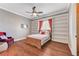 Inviting bedroom boasts custom bookshelves, hardwood floors, and a cozy atmosphere at 5913 Audria Falls Ave, Las Vegas, NV 89131
