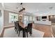 Spacious dining area with natural light and seamless flow to outdoor living space and open floorplan at 5913 Audria Falls Ave, Las Vegas, NV 89131