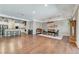 Open-concept living space featuring a stylish dining area that seamlessly connects to the kitchen and living room at 5913 Audria Falls Ave, Las Vegas, NV 89131