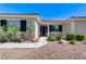 Inviting front entrance with desert landscape, a wide walkway, and modern accents at 5913 Audria Falls Ave, Las Vegas, NV 89131