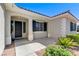 Covered front entryway featuring clean lines, desert landscaping, and modern architectural accents at 5913 Audria Falls Ave, Las Vegas, NV 89131