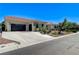 Charming home featuring a spacious driveway and a well-manicured front yard landscape at 5913 Audria Falls Ave, Las Vegas, NV 89131