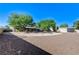 Wide circular driveway, desert landscaping, and privacy trees enhance the property's curb appeal at 5913 Audria Falls Ave, Las Vegas, NV 89131