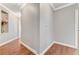 Clean hallway with hardwood floors, soft gray walls, and detailed trim, creating a welcoming space at 5913 Audria Falls Ave, Las Vegas, NV 89131