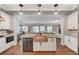 Well-appointed kitchen with stainless steel appliances, a large island, and open layout for easy entertaining at 5913 Audria Falls Ave, Las Vegas, NV 89131