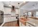 Well-equipped kitchen with stainless steel appliances, copper sink, and stylish cabinetry for a modern look at 5913 Audria Falls Ave, Las Vegas, NV 89131