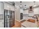 Chef's kitchen with stainless steel refrigerator, double ovens, and ample counter space for meal preparation at 5913 Audria Falls Ave, Las Vegas, NV 89131