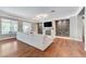 Bright and airy living room with a modern fireplace and large sectional sofa offers a comfortable gathering space at 5913 Audria Falls Ave, Las Vegas, NV 89131