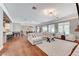 Spacious living room features modern lighting, a large sectional sofa, and seamless flow into the kitchen and dining areas at 5913 Audria Falls Ave, Las Vegas, NV 89131