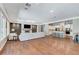 Expansive open-concept living area showcases a modern fireplace and seamlessly connects the kitchen, living, and dining spaces at 5913 Audria Falls Ave, Las Vegas, NV 89131