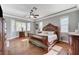 Spacious bedroom with hardwood floors, decorative molding and a ceiling fan at 5913 Audria Falls Ave, Las Vegas, NV 89131