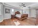 Large bedroom with hardwood flooring, ceiling fan, and lots of natural light at 5913 Audria Falls Ave, Las Vegas, NV 89131