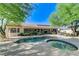 Inviting backyard boasts pool, spa, and lush landscaping for outdoor living and enjoyment at 5913 Audria Falls Ave, Las Vegas, NV 89131