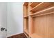 Unfurnished walk-in closet featuring custom wooden shelving and ample storage space for organization at 5913 Audria Falls Ave, Las Vegas, NV 89131
