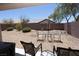 Low-maintenance backyard featuring gravel landscaping and a patio with an outdoor seating area at 5935 Saddle Horse Ave, Las Vegas, NV 89122