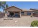 Backyard featuring gravel landscaping, a covered patio, an outdoor seating area, and a spa at 5935 Saddle Horse Ave, Las Vegas, NV 89122