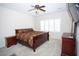 Serene bedroom with carpet, large windows, ceiling fan, and contemporary furniture at 5935 Saddle Horse Ave, Las Vegas, NV 89122