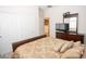 Comfortable bedroom with a bed, dresser, and mirror creating a relaxing and inviting space at 5935 Saddle Horse Ave, Las Vegas, NV 89122
