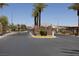 Community gate featuring stone pillars and wrought iron fencing for a secure entrance at 5935 Saddle Horse Ave, Las Vegas, NV 89122