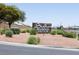 Stallion Mountain Golf Club signage surrounded by desert landscaping and situated near a paved road at 5935 Saddle Horse Ave, Las Vegas, NV 89122