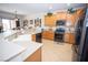 Modern kitchen with stainless steel appliances, tiled floors and stone countertops at 5935 Saddle Horse Ave, Las Vegas, NV 89122