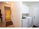 Convenient laundry room with modern appliances and plenty of storage for supplies at 5935 Saddle Horse Ave, Las Vegas, NV 89122