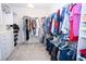 Well-organized walk-in closet with built-in shelving and ample storage space for clothes and accessories at 5935 Saddle Horse Ave, Las Vegas, NV 89122