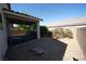 Outdoor living space with a covered patio and gravel landscaping for low maintenance at 6040 Eganridge Ct, North Las Vegas, NV 89081