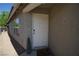 View of the front door with small porch and decorative potted plant at 6040 Eganridge Ct, North Las Vegas, NV 89081