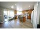 Modern kitchen with an island, bar seating, and sliding door access to patio at 6040 Eganridge Ct, North Las Vegas, NV 89081