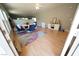 Bright living area with hardwood floors, dining table, and neutral decor at 6040 Eganridge Ct, North Las Vegas, NV 89081