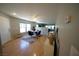 Open-concept living area with hardwood floors, neutral walls, and recessed lighting at 6040 Eganridge Ct, North Las Vegas, NV 89081