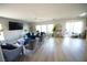 Spacious living room with hardwood floors, neutral walls, and large windows at 6040 Eganridge Ct, North Las Vegas, NV 89081