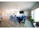 Bright living room with modern furnishings, wood floors, and large windows at 6040 Eganridge Ct, North Las Vegas, NV 89081