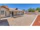 Sizeable backyard area with covered patio, offering shade and space for entertaining guests at 6112 Blossom Knoll Ave, Las Vegas, NV 89108