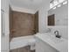Clean bathroom with tiled shower-tub combo and modern vanity at 6112 Blossom Knoll Ave, Las Vegas, NV 89108