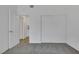 Neutral bedroom featuring carpet, closet, and an open door at 6112 Blossom Knoll Ave, Las Vegas, NV 89108